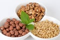 Pine nuts, hazelnut, walnuts in a bowl Note to editor:Pine nuts, hazelnut, walnuts in a bowl isolated on