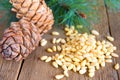 Pine nuts on wooden background