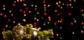 Pine sprig, beautiful Christmas toys, and little souvenir, on dark background