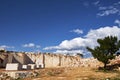 Pine tree and marble blocks at abandoned marble quarry in the sunny day Royalty Free Stock Photo