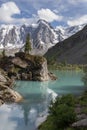 Pine tree on the rock in beautiful Shavlinsky lake. Royalty Free Stock Photo