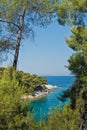 Pine tree on a rock over crystal clear turquoise water, Cape Amarandos at Skopelos island Royalty Free Stock Photo