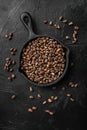 Pine wild organic nut, on black dark stone table background, top view flat lay Royalty Free Stock Photo