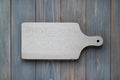 Pine wood cutting board on a wooden gray background Royalty Free Stock Photo