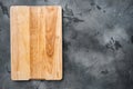 Pine wooden cutting board, on gray stone table background, top view flat lay , with copy space for text or your product Royalty Free Stock Photo