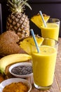 Pineapple, Banana, Coconut, Turmeric and Chia Seed Smoothies Royalty Free Stock Photo