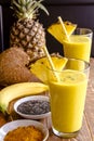 Pineapple, Banana, Coconut, Turmeric and Chia Seed Smoothies Royalty Free Stock Photo