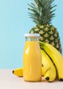 Fresh Pineapple and banana juice or smoothie in botle.