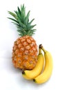 Pineapple and bananas on white Royalty Free Stock Photo