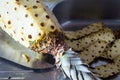 Pineapple being peeled over stainless steel sink