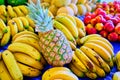 Pineapple bunches of bananas and apples at market Royalty Free Stock Photo