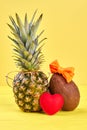 Pineapple, coconut and red heart. Royalty Free Stock Photo