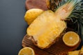 Pineapple on cutting board. Fresh sweet half cut pineapple. Sliced pineapple tropical fruit sliced with citrus lemons on Royalty Free Stock Photo