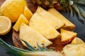 Pineapple on cutting board. Summer tropical fruit Sliced pineapple slicing cooking process in kitchen on dark background Royalty Free Stock Photo