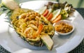 Pineapple fried rice with shrimps, Thai food popular menu of fried rice, beautiful food decoration, serve fried rice in half fresh Royalty Free Stock Photo