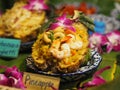 Pineapple Fried Rice topping with Fried cashews and shrimp in pineapple bowl, Thai food Royalty Free Stock Photo