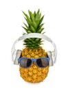 Pineapple fruit in a glasses with headphone isolated