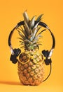 Pineapple with headphones and glasses
