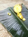 Pineapple and its slices placed in a green banana leaf Royalty Free Stock Photo