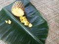 Pineapple and its slices placed in a green banana leaf. Royalty Free Stock Photo