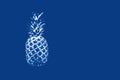 Pineapple in monochrome on a blue background. Concept abstraction, surrealism, color of the year 2020, food