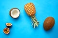 Pineapple, passion fruit and coconut on blue Royalty Free Stock Photo