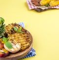 Pineapple and peach barbecued grilled picnic. Free space for text. Summer Lunch. Copy space. flat aly Royalty Free Stock Photo