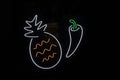 pineapple and pepper on a dark background with a fluorescent border. Vegetables Royalty Free Stock Photo