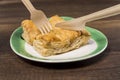 Pineapple pie on white plate with fork and knife Royalty Free Stock Photo