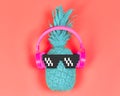 Pineapple in pink headphones and pixel glasses.