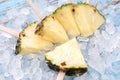 Pineapple popsicle yummy fresh summer fruit sweet dessert wood teak Royalty Free Stock Photo