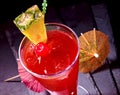 Pineapple red cocktail with cherry and umbrella Royalty Free Stock Photo