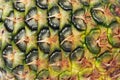 Pineapple skin texture closeup. Pineapple texture. Exotic fruit close-up. Ripe yellow fruit peel macro photo. Pineapple skin surfa