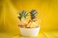 pineapple slice on plate for food fruit ripe pineapple on yellow background, fresh pineapple tropical fruits summer Royalty Free Stock Photo