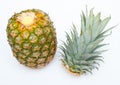 Pineapple with sliced top on white background