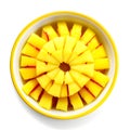 pineapple slices in a bowl on a white background. top view