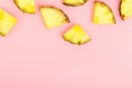 Pineapple slices on a pink background. Tropical juicy exotic healthy fruit. Copy space, top view, flat lay.