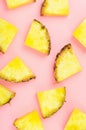 Pineapple slices on pink background. Tropical juicy exotic healthy fruit texture. Top view, flat lay, minimal.