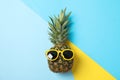 Pineapple with sunglasses on three tone background Royalty Free Stock Photo
