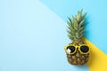 Pineapple with sunglasses on three tone background Royalty Free Stock Photo