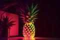 Pineapple on a table with dark background, in neon red, yellow, green light. Copy space. AI generated Royalty Free Stock Photo