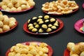 Pineapple tarts on red plates