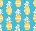 Pineapple texture with hand drawn yellow fruits at blue background. Seamless vector pattern. Royalty Free Stock Photo