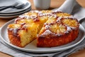 Pineapple upside-down cake with slice and powdered sugar Royalty Free Stock Photo
