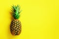 Pineapple on yellow background. Top View. Copy Space. Pattern for minimal style. Pop art design, creative concept Royalty Free Stock Photo
