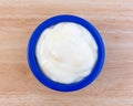 Pineapple yogurt in a blue dish on table