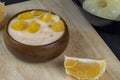 pineapple yogurt with slices of ripe yellow orange