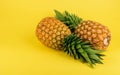 Pineapples on yellow background top view Royalty Free Stock Photo