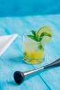 Pineapple mojito cocktail on a bright blue background