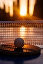 Ping pong ball and paddle at sunset Royalty Free Stock Photo